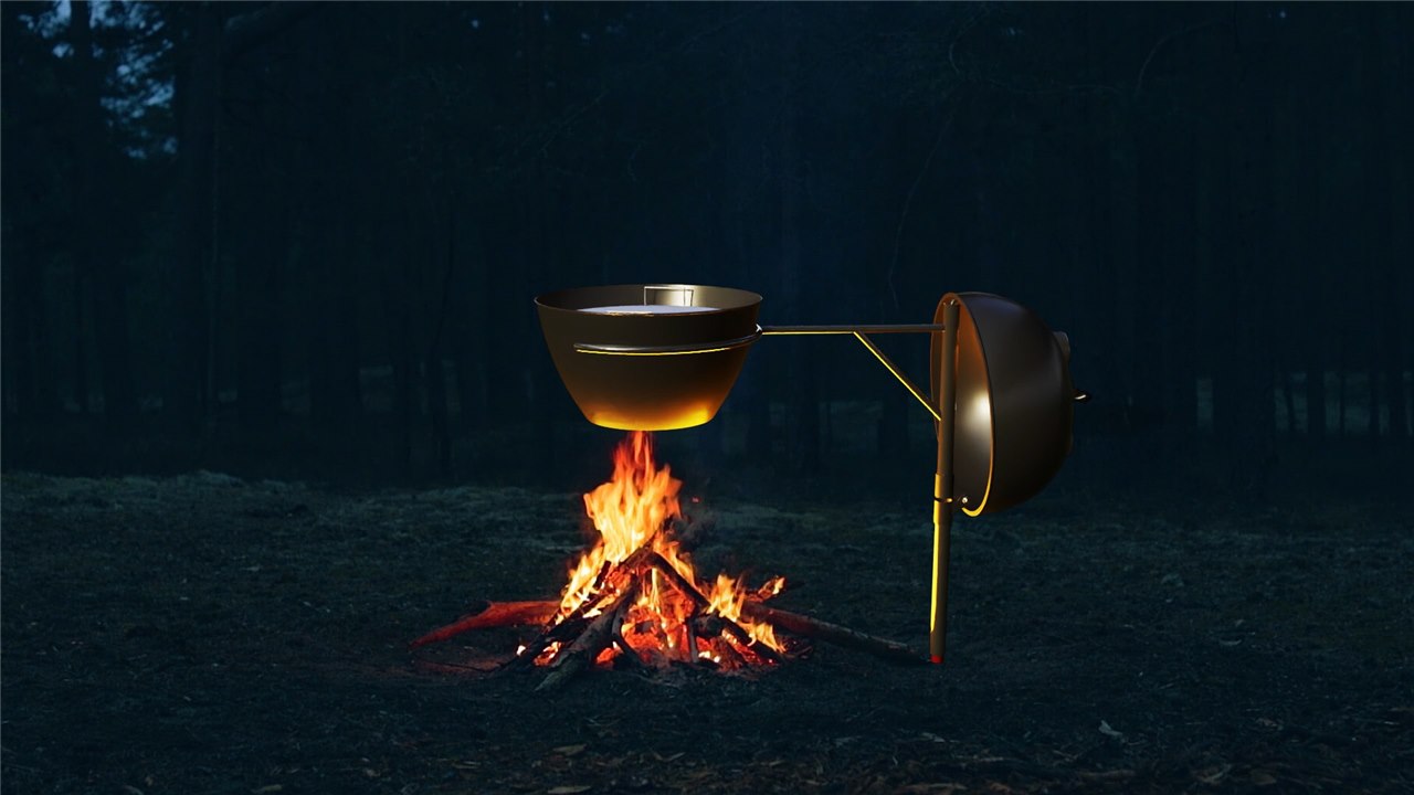 Wraparound cradle arms centering the kettle over the campfire